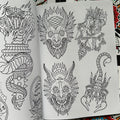 Inside pages of Sketchbook Vol. 4 by Mors featuring several line drawings, including demon faces, a scorpion, a snake enveloping a torck, and a wolf head pierced by an arrow.