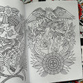 Inside pages of Sketchbook Vol. 4 by Mors featuring several line drawings, with the main focus being a version of The Pharaoh's Horses framed in an emblem, and adorned with an eagle and flowers.