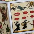 Inside pages of of Rosie Folk Art Tattoo Flash book featuring traditional flash sheets in color showcasing animals, lips, and reapers.