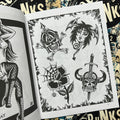 Inside pages of Tattoo Punks Vol. 2 featuring black and white flash of punk motifs including a demon girl head, 2 warrior skulls, and a rose with a spider web.