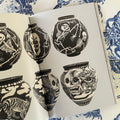 Inside pages of Tattoo X Ceramics featuring vases painted in black and white with skull motifs by Dr. Lakra.