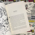Inside pages of Keeping the Spiders by Joshua James featuring  a page of Chapter 7 and a traditional black and grey illustration of a skull.