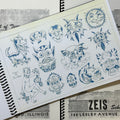 Inside pages of Dana Brunson - Zeis School of Tattooing Vol. 1 featuring faces with various expressions all done in blue ink and vintage traditional style. The faces are mostly demon-like ar animalistic.