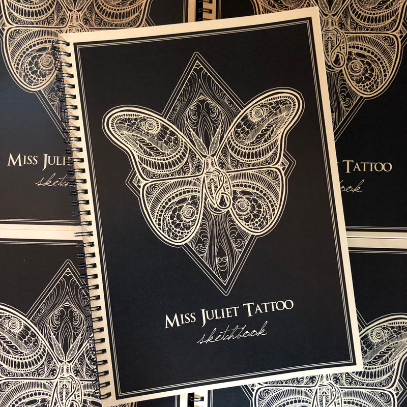 Belzel Books presents Miss Juliet Tattoo Sketchbook. Butterfly on black cover.