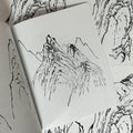 Inside pages of Rocks & Mountains featuring a line drawing of mountains done in the traditional Japanese style.
