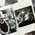 Inside pages of Chuco Moreno Book featuring photographs of Chuco tattoing and posing next to one of his back pieces.