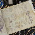 Inside pages Tattoo Master Pinky Yun: The Don Ed Hardy Collection featuring an assortment of dragon line drawings.