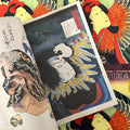 Inside pages of Kunisada featuring a color woodblock print of man.