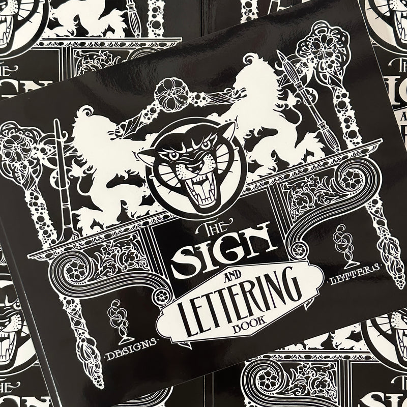 Front cover of The Sign and Lettering Book featuring black and white ornate imagery.