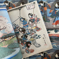 Inside pages of Hiroshige featuring a woodcut print of ladies dancing.