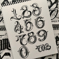 Big Meas's Number (alphabet) lettering in black ink.