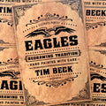 Front cover of Tim Beck - Eagles: Redrawing Tradition featuring  an eagle and black font on a tan cardboard looking cover. 
