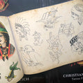 Native American, anchors, roses, imagery from the Christian Warlich Tattoo Flash Book.