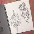 Skull and snakes with daggers, from  The Complete Sketchbook Set by Mike "Rollo" Malone.