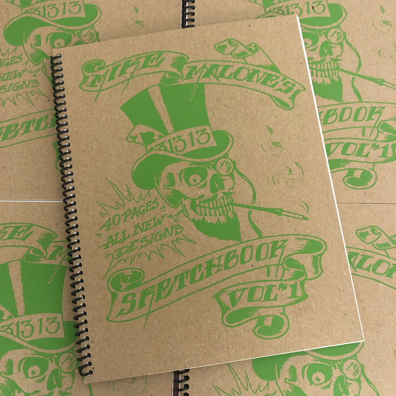 Front cover of Sketchbook Vol. 1 1996 by Mike "Rollo" Malone featuring green skull art and print on a cardboard cover.