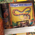 Snake wrestler from Painters of the Peculiar: A Guide to Sideshow Banner Artists & their Respective Work by Michael Papa & Johnny Meah.