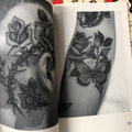 Head and arm black-and-grey tattoos, from Cien Roses by Carlos Truan & Danny G.