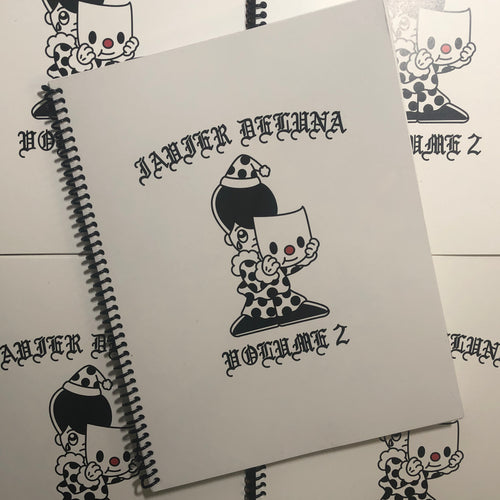 Front cover of Javier DeLuna - Volume 2 featuring a sad little clown on a white spiral bound cover.