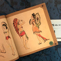 Inside pages of Jonathan Shaw's Vintage Tattoo Flash Collection - Pinups Vol.1 featuring pinups with Asian and Native American attire.