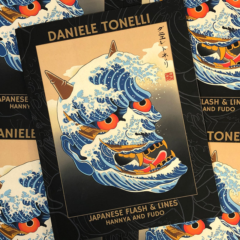 Front cover of Daniele Tonelli - Japanese Flash & Lines featuring  a hannya mask inspired by Hokusai's Great Wave on a gradient background, a thick border with dark background and line drawings, and simple tan lettering on a soft bound cover