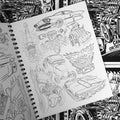 Inside pages of Dennis McPhail - Artist at Large featuring a range of line drawings of hot rods and related car imagery.