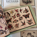 Hearts with name ribbons in  Handbook for the Traveling Tattooer: A Collection of Vintage Flash by Gordon "Wrath" McCloud.
