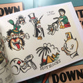 Penguin and cat art in Downtown Tattoo Flash Book.