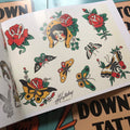 Horseshoe and butterfly art in Downtown Tattoo Flash Book.