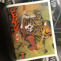 Inside page of Mike Destefano - The Book Of Death presenting a Japanese scene of a brown-cloaked samurai skeleton battling a green dragon.
