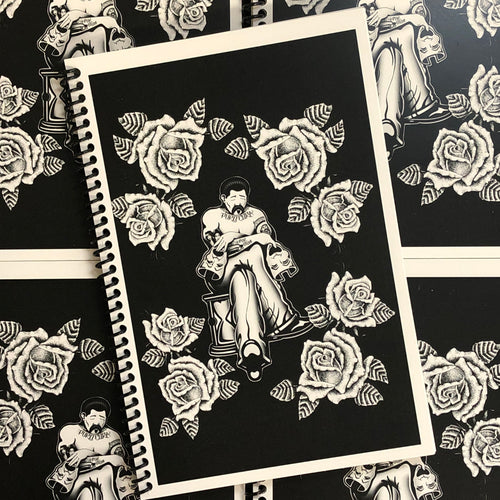 Cover of Chuco Moreno's - Rose Book displaying a cholo sitting in the center with his eye closed. In one hand he has a smiling mask, and in the other a crying mask. Fine-line roses surround him and the whole scene is set on a black background..