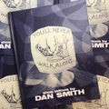 Front cover of Dan Smith - You'll Never Walk Alone showcasing two sets of feet. One set of feet is wearing cheetah print sneakers and stepping on the other set of feet, which is wearing combat boots. 